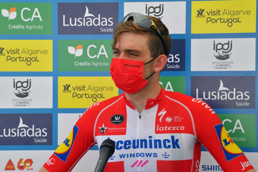 LAGOA PORTUGAL MAY 08 Kasper Asgreen of Denmark and Team Deceuninck QuickStep stage winner celebrates at podium during the 47th Volta Ao Algarve 2021 Stage 4 a 203km Individual Time Trial stage from Lagoa to Lagoa Mask Covid safety measures ITT VoltAlgarve VAlgarve2021 on May 08 2021 in Lagoa Portugal Photo by Luc ClaessenGetty Images