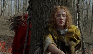 The Village Bryce Dallas Howard hides from a beast behind a tree