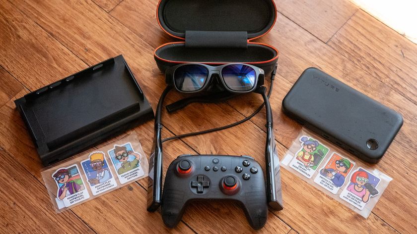 A pair of Viture Pro glasses with the Viture Pro Neckband, 8BitDo x Viture Bluetooth controller, the Viture Mobile Dock, and the Nintendo Switch adapter