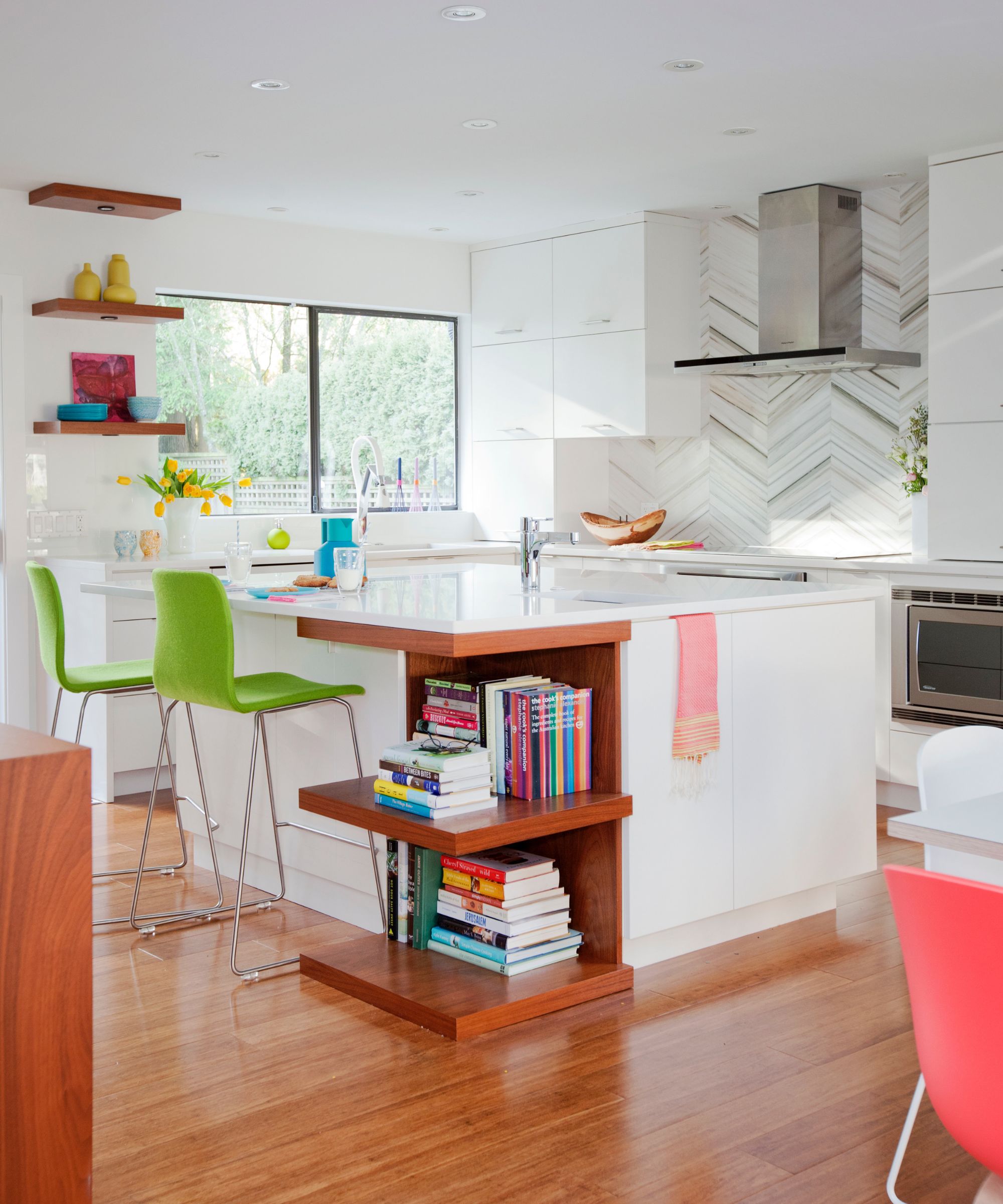 A white kitchen from the 2010s with mid-wood accents and colorful decor