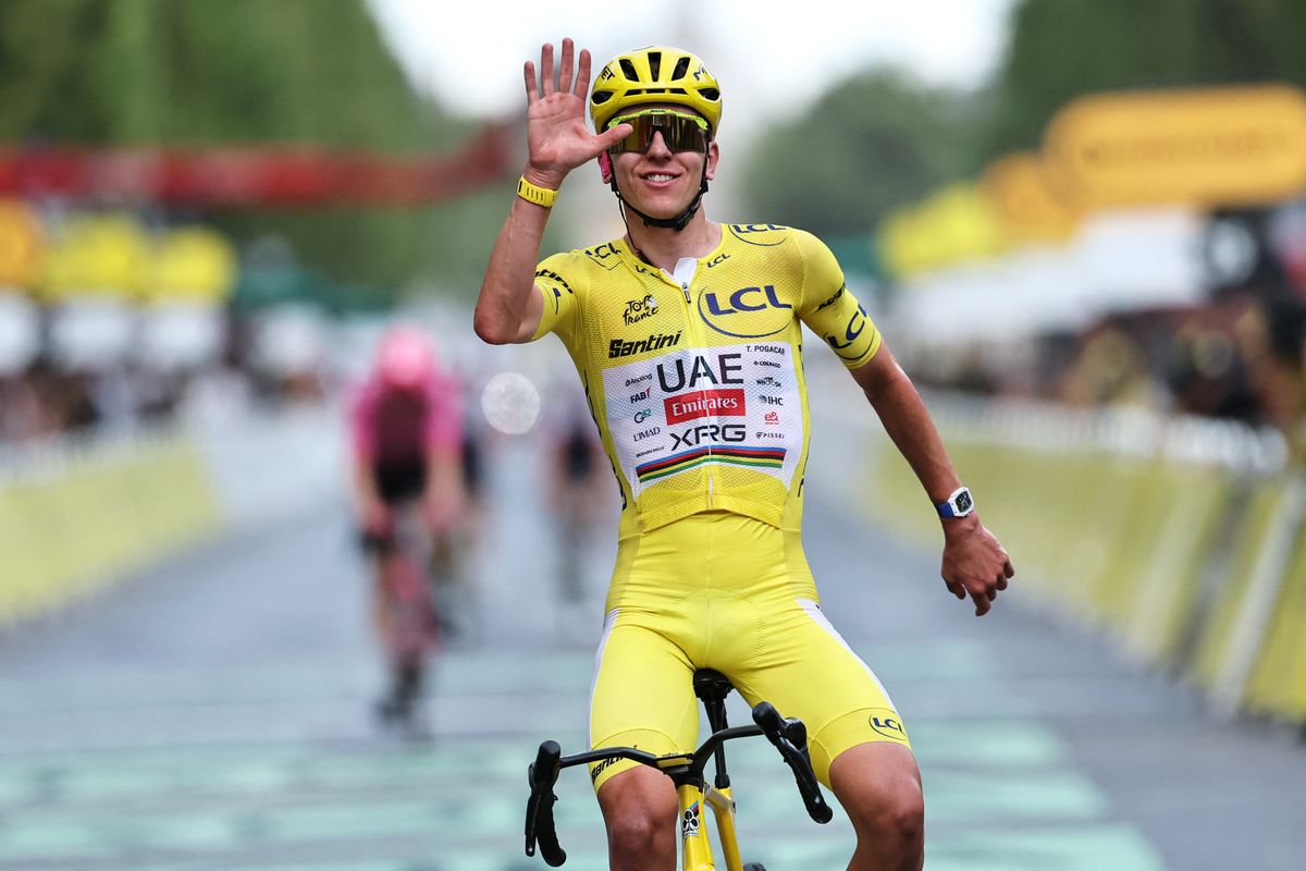 UAE Team Emirates - XRG's Slovenian rider Tadej Pogacar celebrates his overall victory as he crosses the finish line of the 21st stage of the 113th edition of the Tour de France cycling race, 88,7 km starting and finishing in Paris, on July 26, 2026. (Photo by Anne-Christine POUJOULAT / AFP via Getty Images)