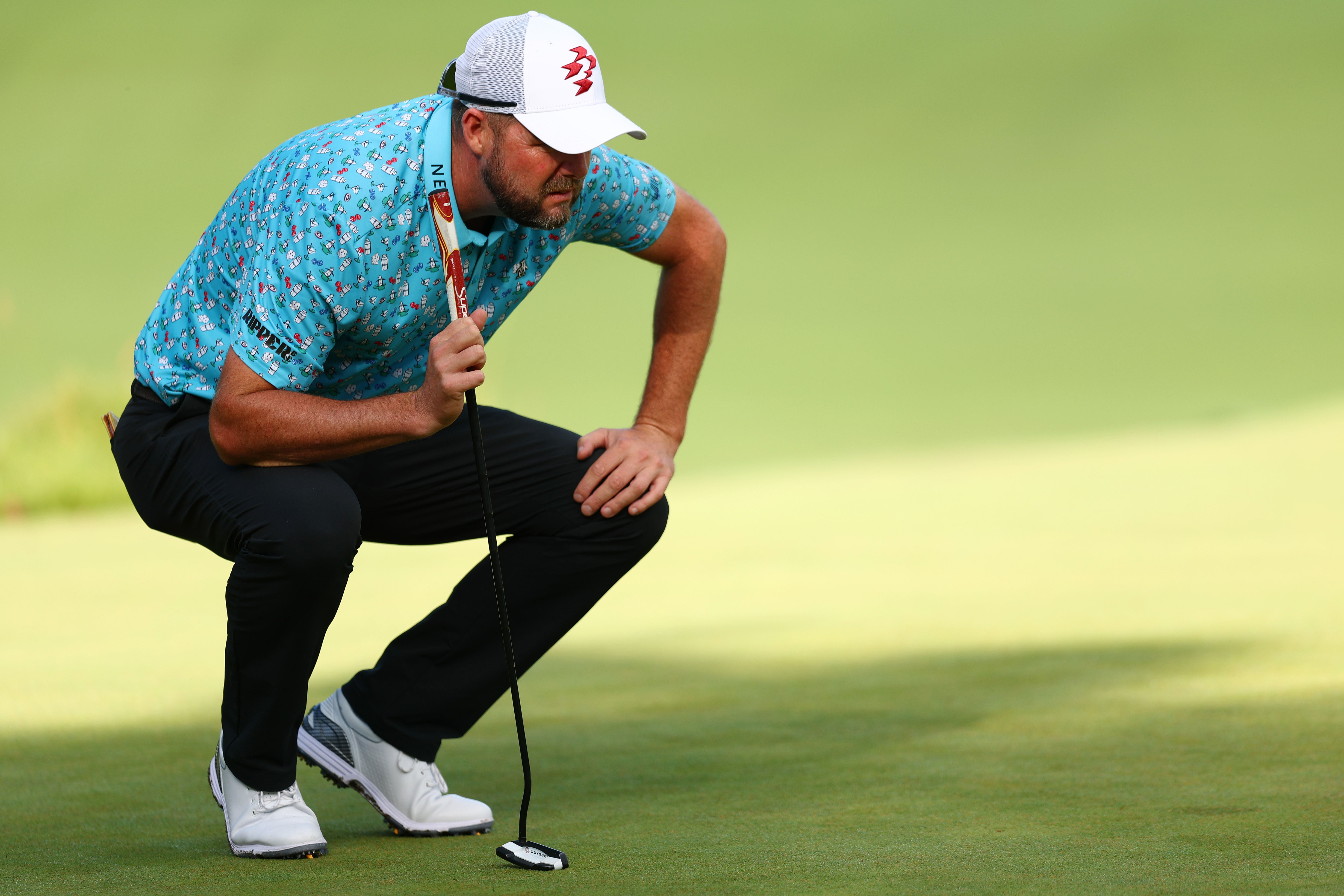 Marc Leishman lines up a putt