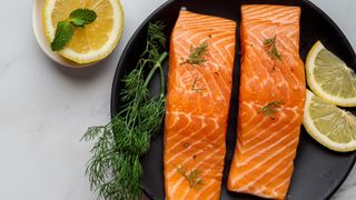 Raw salmon fillets on a plate