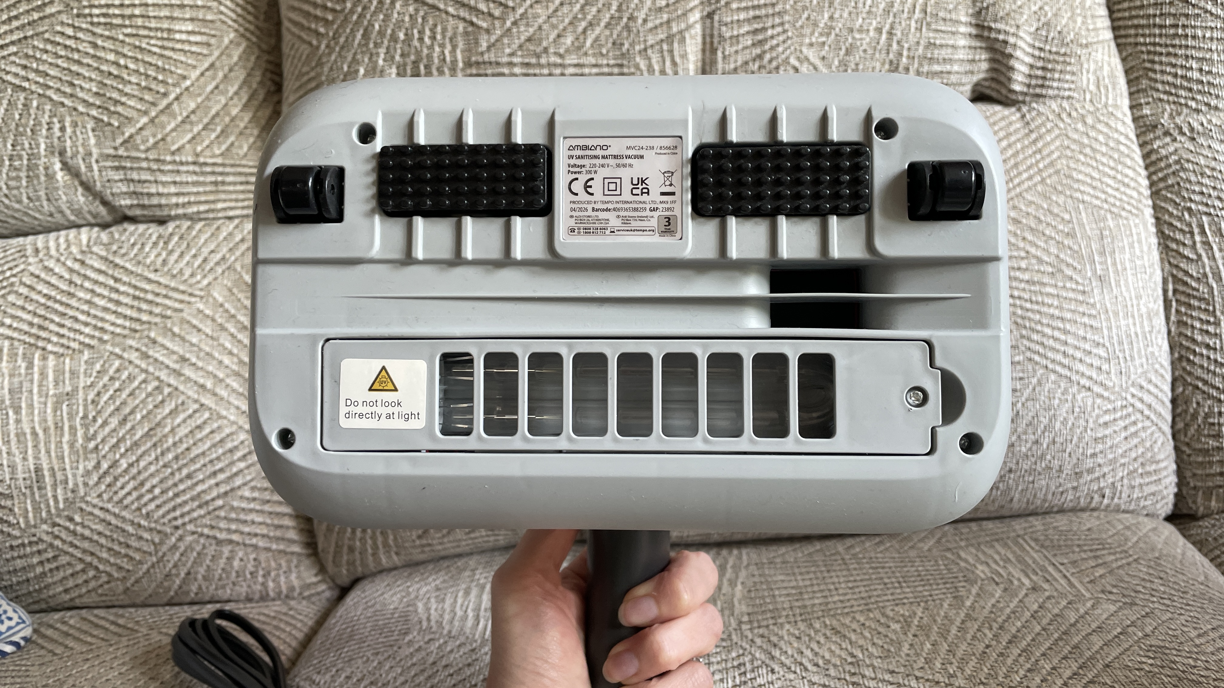 Aldi's Ambiano Mattress Vacuum being used on a mattress and sofa