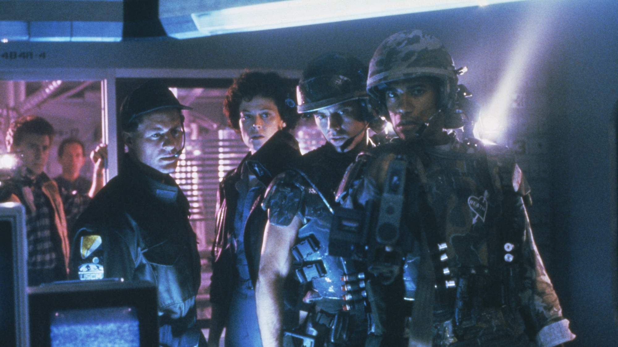 Ellen Ripley (Sigourney Weaver) and the marines in the film Aliens, directed by James Cameron.
