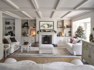 new england style house sitting room with fireplace and cream furniture