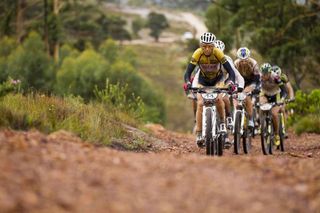 Christoph Sauser of 36One-Songo-Specialized leads a group up the hill during stage 5 of the 2012 Absa Cape Epic Mountain Bike stage race from the Overberg Primary