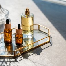 three beauty products on glass tray