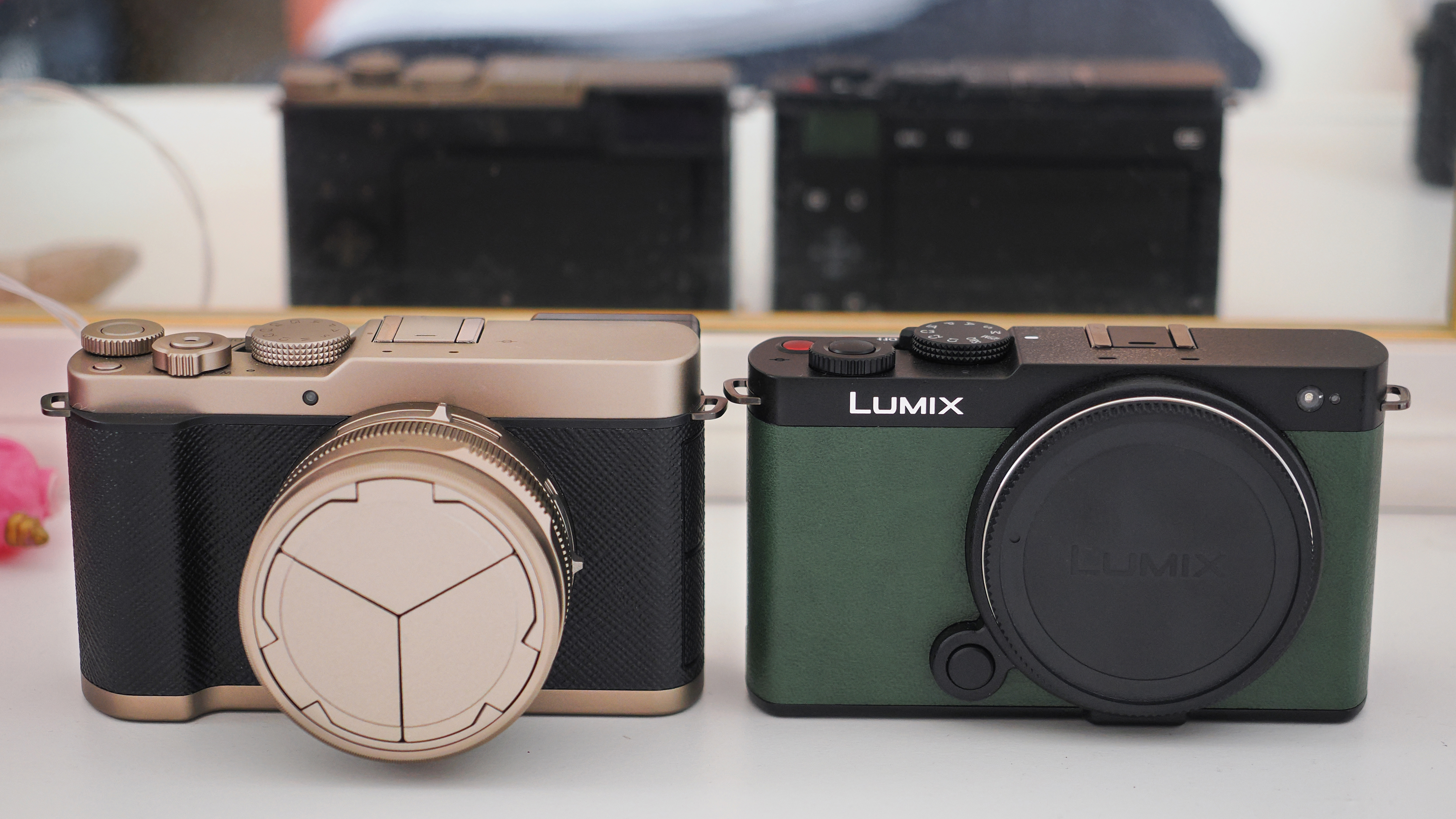 Panasonic Lumix L10 next to a Panasonic Lumix S9