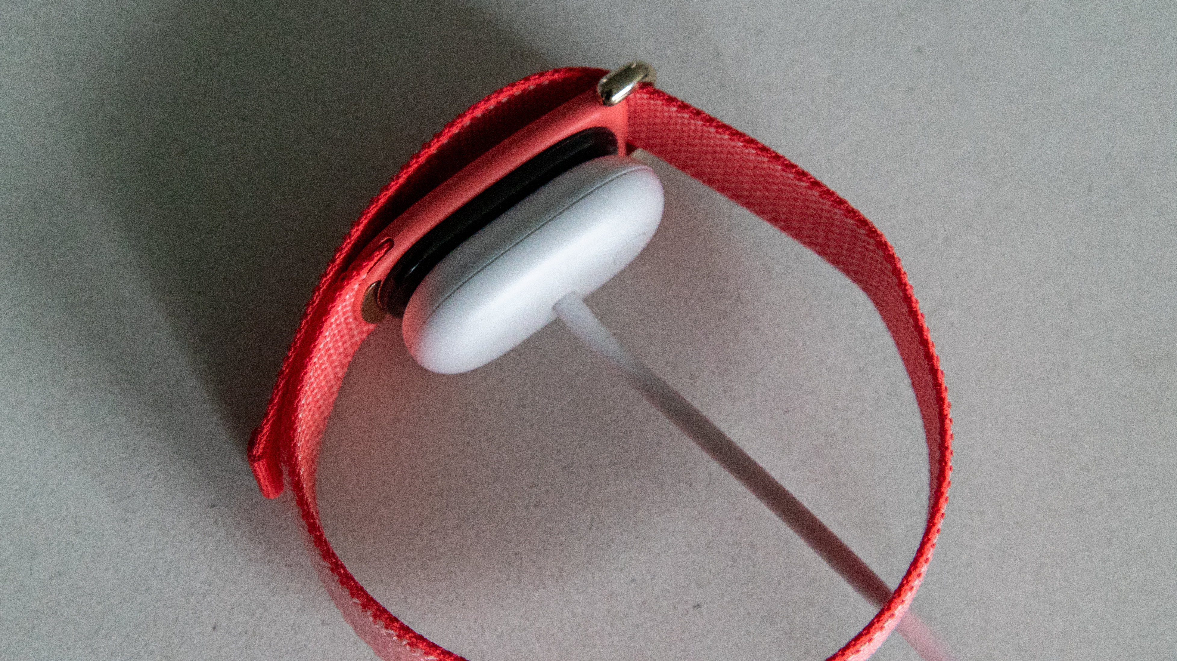 The Fitbit Air with the charger connected
