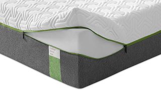 Tempur Hybrid Elite Mattress shown with the corner of the cover unzipped to expose the NASA-developed Tempur foam inside