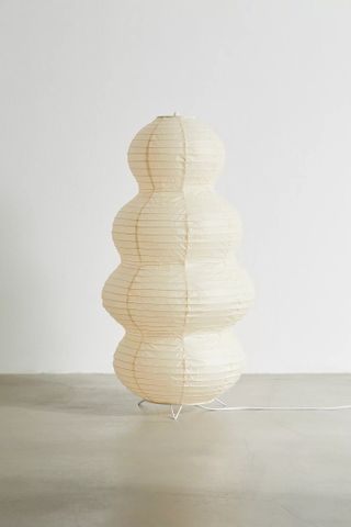 paper lantern floor lamp against white backdrop at daytime