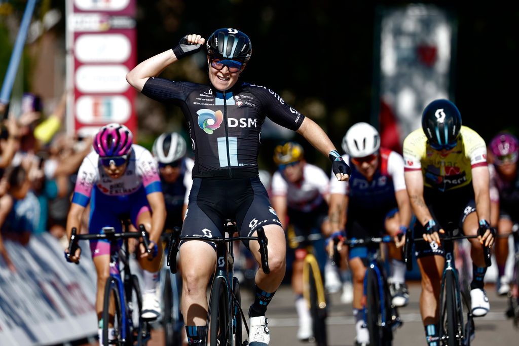 GENNEP NETHERLANDS SEPTEMBER 01 Charlotte Kool of Netherlands and Team DSM celebrates at finish line as stage winner Georgia Baker of Australia and Team BikeExchange Jayco and Lorena Wiebes of Netherlands and Team DSM Yellow leader jersey during the 25th Simac Ladies Tour 2022 Stage 3 a 1391km stage from Gennep to Gennep SLT2022 UCIWWT on September 01 2022 in Gennep Netherlands Photo by Bas CzerwinskiGetty Images