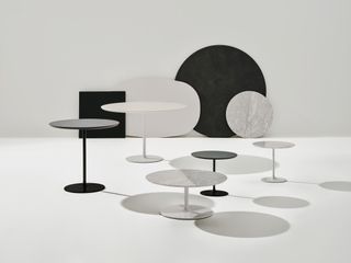 Milan Design Week Arper Dizzie round dining tables in black and white and two different sizes