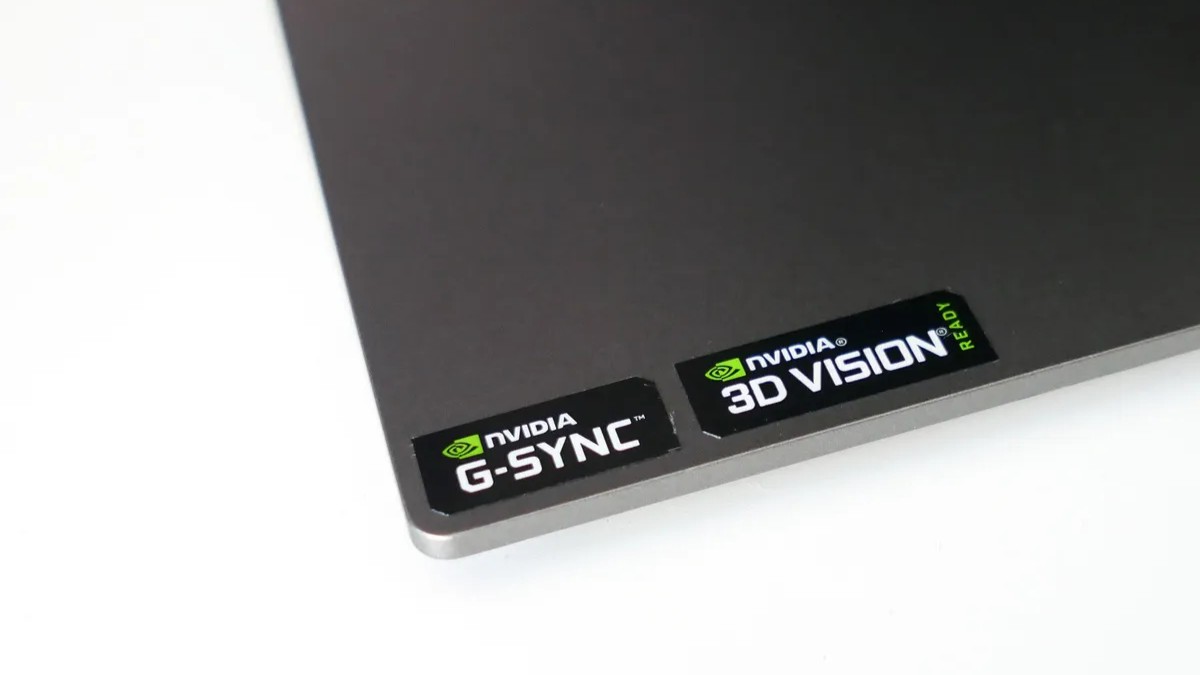 A photo of NVIDIA G-Sync and 3D Vision stickers on the base of the Dell S2417DG monitor.