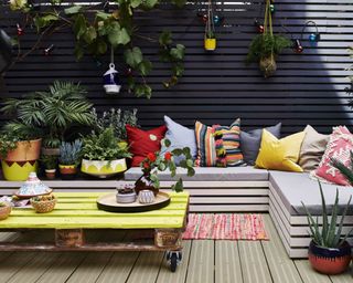 A pallet coffee table with bright yellow paint decor