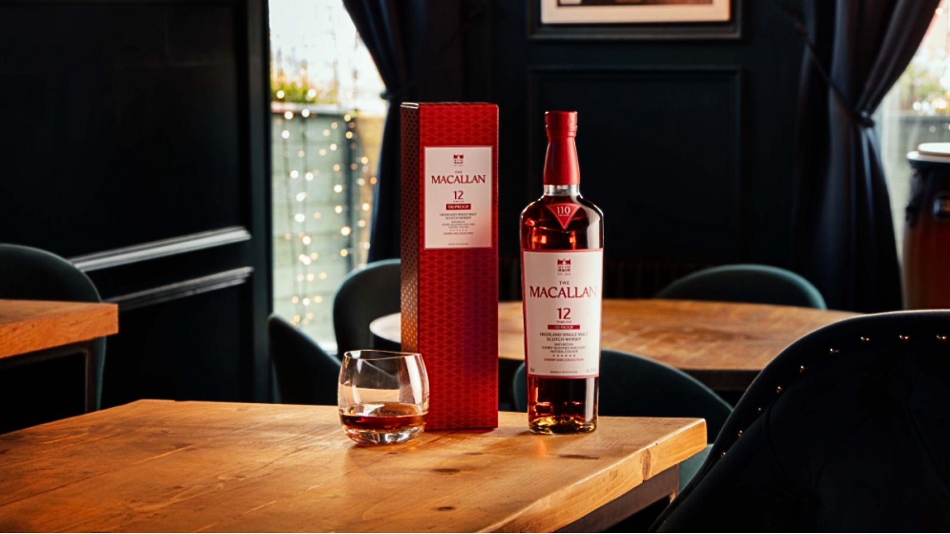 an image of the macallan 12 on a table with a dram poured out in a glass