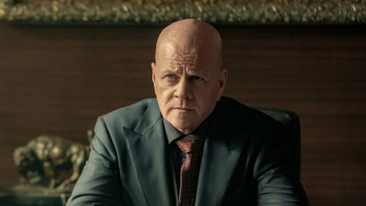 Michael Cudlitz&#039;s Lex Luthor seated and wearing a business suit