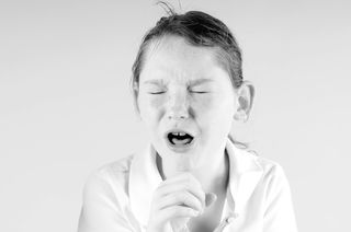 a girl coughing