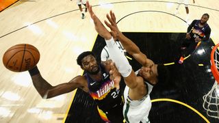 Deandre Ayton #22 of the Phoenix Suns attempts a shot over Giannis Antetokounmpo #34 of the Milwaukee Bucks in game two of the NBA Finals at Phoenix Suns Arena on July 8, 2021 in Phoenix, Arizona.