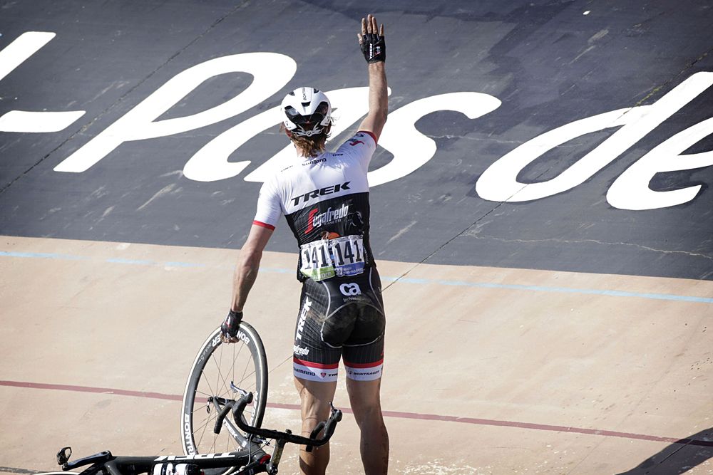 Fabian Cancellara gets up after crashing with the flag in the velodrome at Paris-Roubaix