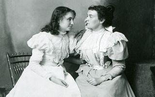 An image of Helen Keller with her teacher, Anne Sullivan, in 1897. Keller learned to "lip read" with her hands.