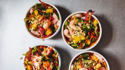 herby mango salad in bowls