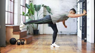 person using the TRX Bandit handle for their resistance band workout