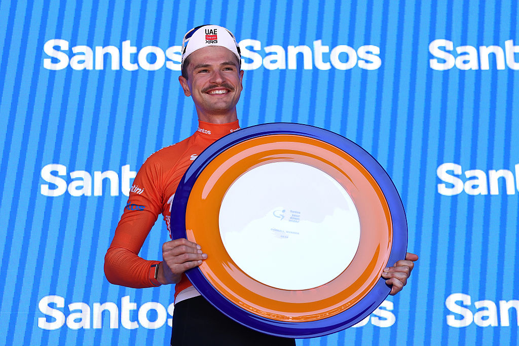 STIRLING, AUSTRALIA - JANUARY 25: Jay Vine of Australia and UAE Team Emirates - Orange Santos Leader&amp;apos;s Jersey celebrates at podium as overall race winner after the 26th Santos Tour Down Under 2026, Stage 5 a 169.8km stage from Stirling to Stirling / #UCIWT / on January 25, 2026 in Stirling, Australia. (Photo by Con Chronis/Getty Images)