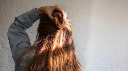 back view of woman with half up hairstyle