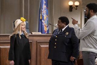 Abby wearing a Blossom hat on Night Court