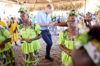 Prince William reportedly made a rare comment about Prince Harry during his Belize trip, seen here dancing
