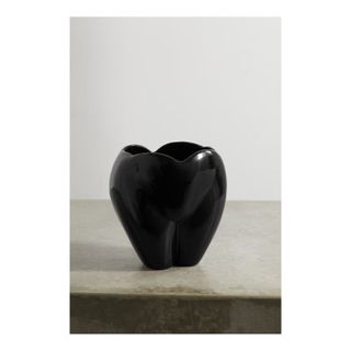 black ceramic vase in shape of body