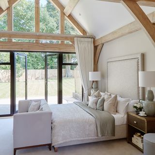 bedroom with floor to ceiling and table lamp