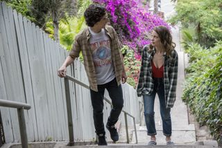 Paul Rust and Gillian Jacobs walk up an outdoor staircase in Los Angeles, in 'Love'