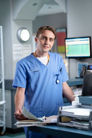 Cam without his curtain hair-do in Casualty's newly released image.