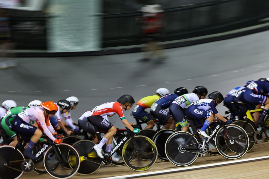 competitors cycle in the Womens Elimination finals during the UCI Track Cycling World Championships at the Velodrome of SaintQuentinenYvelines southwest of Paris on October 13 2022 Photo by Thomas SAMSON AFP Photo by THOMAS SAMSONAFP via Getty Images