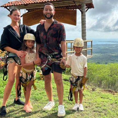 Chrissy Teigen poses with John Legend and kids in Mexico