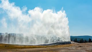 Old Faithful erupting at Yellowstone National Park