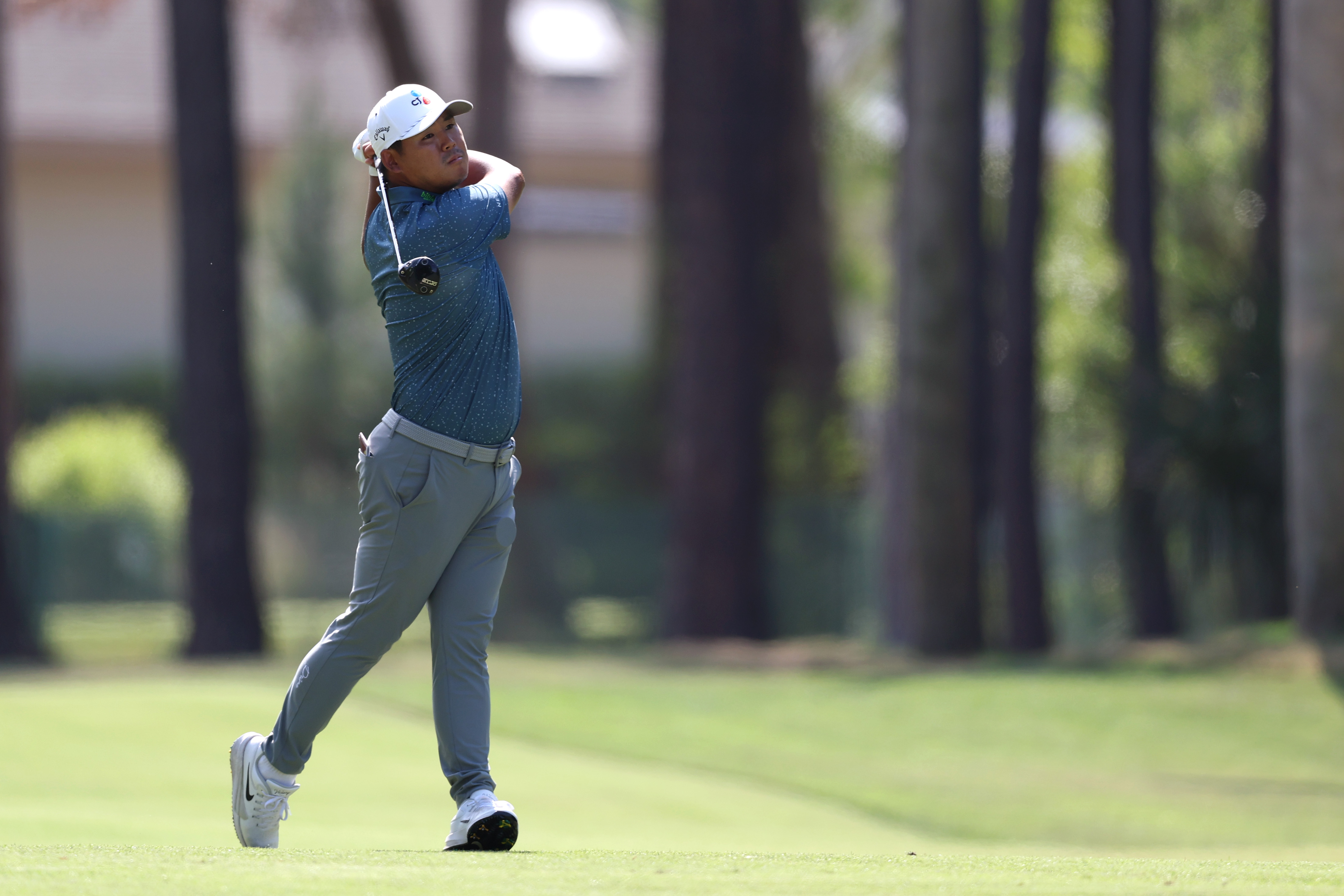 Si Woo Kim plays a shot on the 15th hole during the first round of the RBC Heritage 2026 at Harbour Town Golf Links