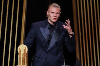 Manchester City's Norwegian forward Erling Haaland gestures on stage as he receives the Gerd Muller Trophy for Best Striker during the 2023 Ballon d'Or France Football award ceremony at the Theatre du Chatelet in Paris on October 30, 2023.