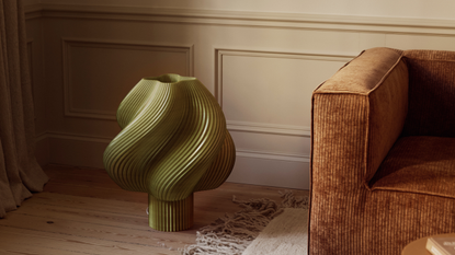 soft serve table light in green on the floor in a living room