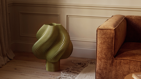 soft serve table light in green on the floor in a living room