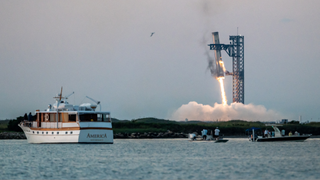 Starship's Super Heavy Booster is grappled at the launch pad in Starbase near Boca Chica, Texas, on October 13, 2024, during the Starship Flight 5 test.