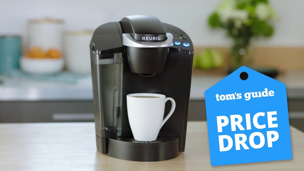 A Keurig K-Classic Coffee Maker shown with a white coffee cup on a kitchen counter