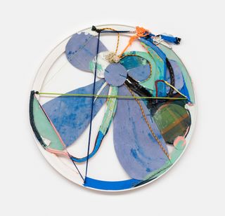 cotton cutouts and ropes overlapping on a round canvas