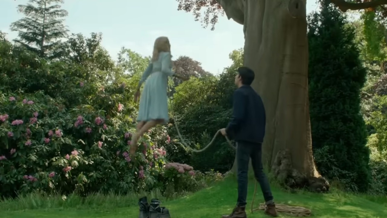 A tethered woman floating in Miss Peregrine's Home for Peculiar Children