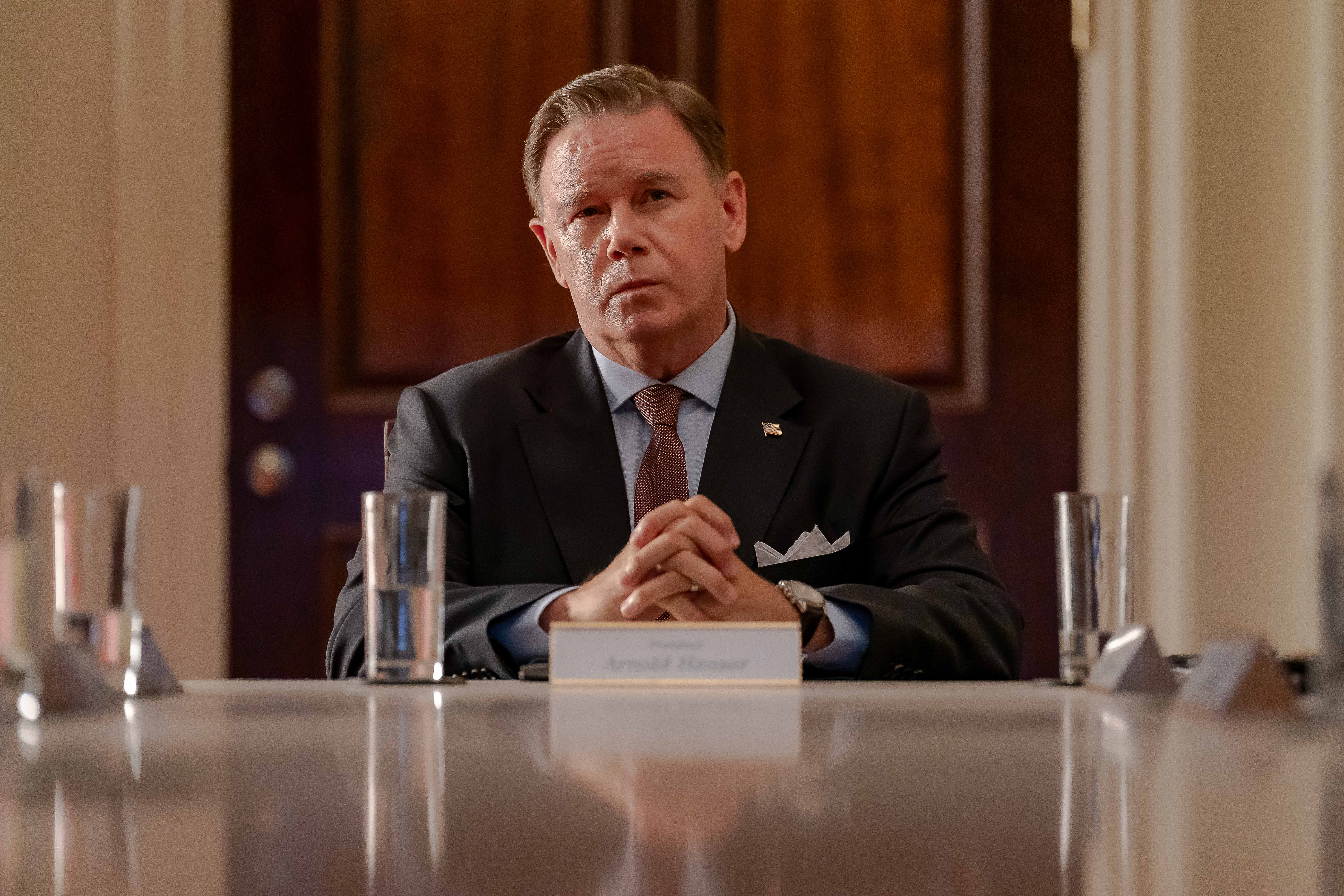 Spencer Garrett as the president sitting at the head of a conference table in &#039;Tempest.&#039;