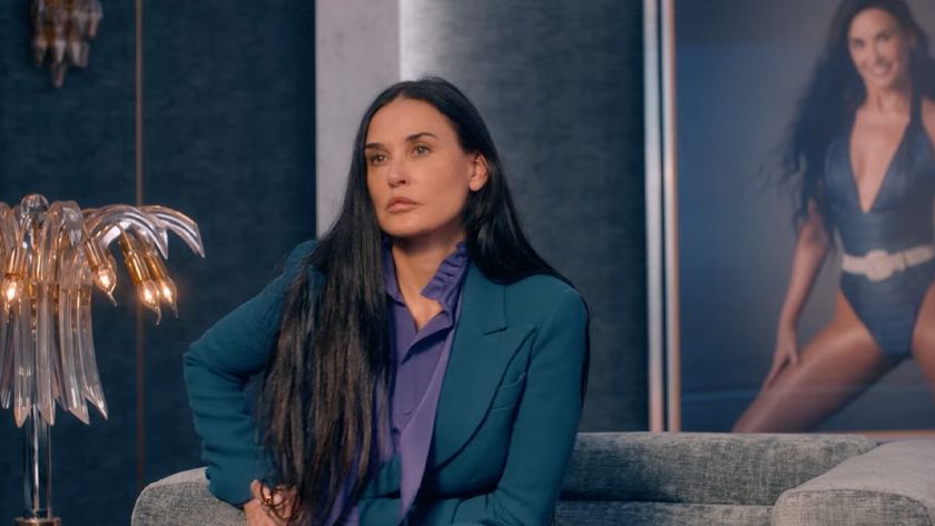 Demi Moore looks stoic, starring in a blue blazer and purple top in the body horror flick &quot;The Substance.&quot; 