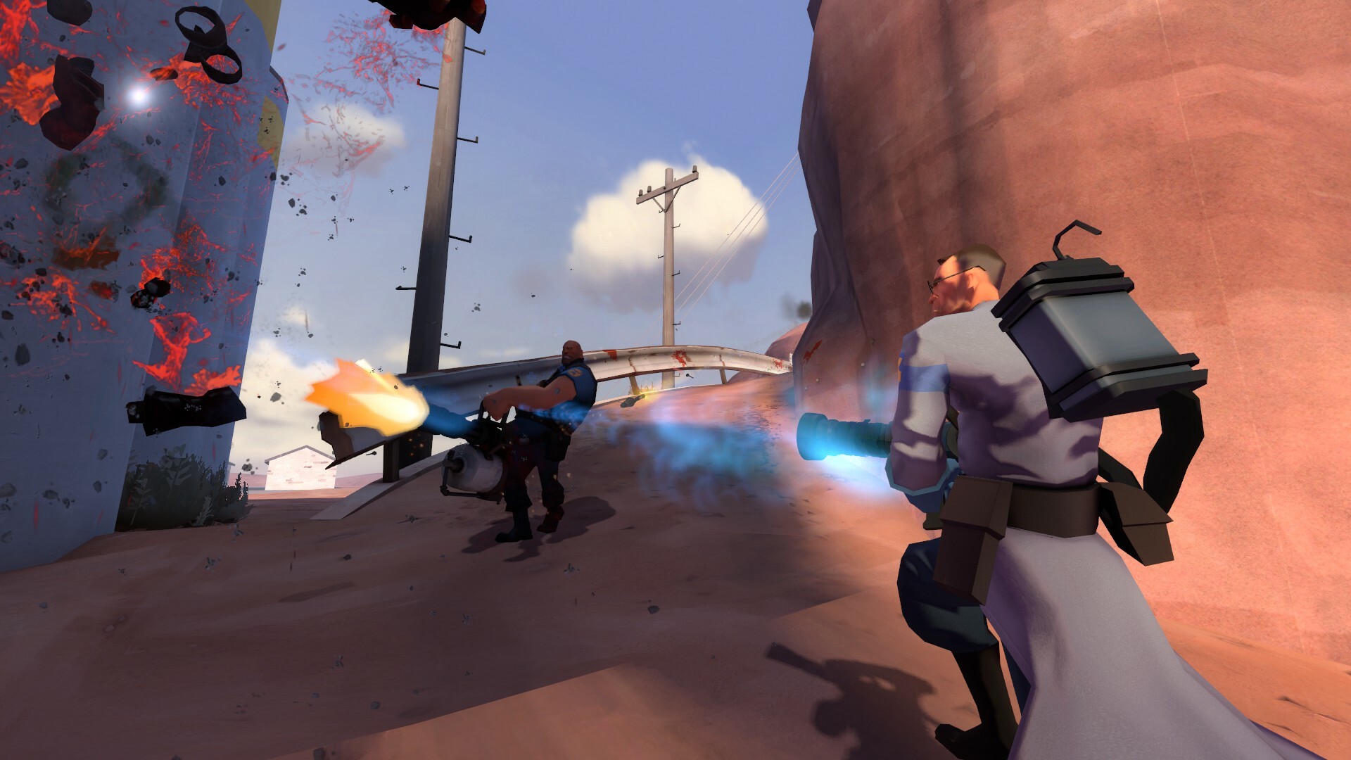 The heavy gibs an enemy with his minigun while the medic heals him in Pre-Fortress 2